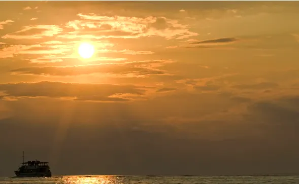 Small boat heading out for the night